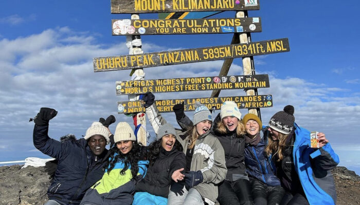 Friends on top of Mt. Kilimanjaro